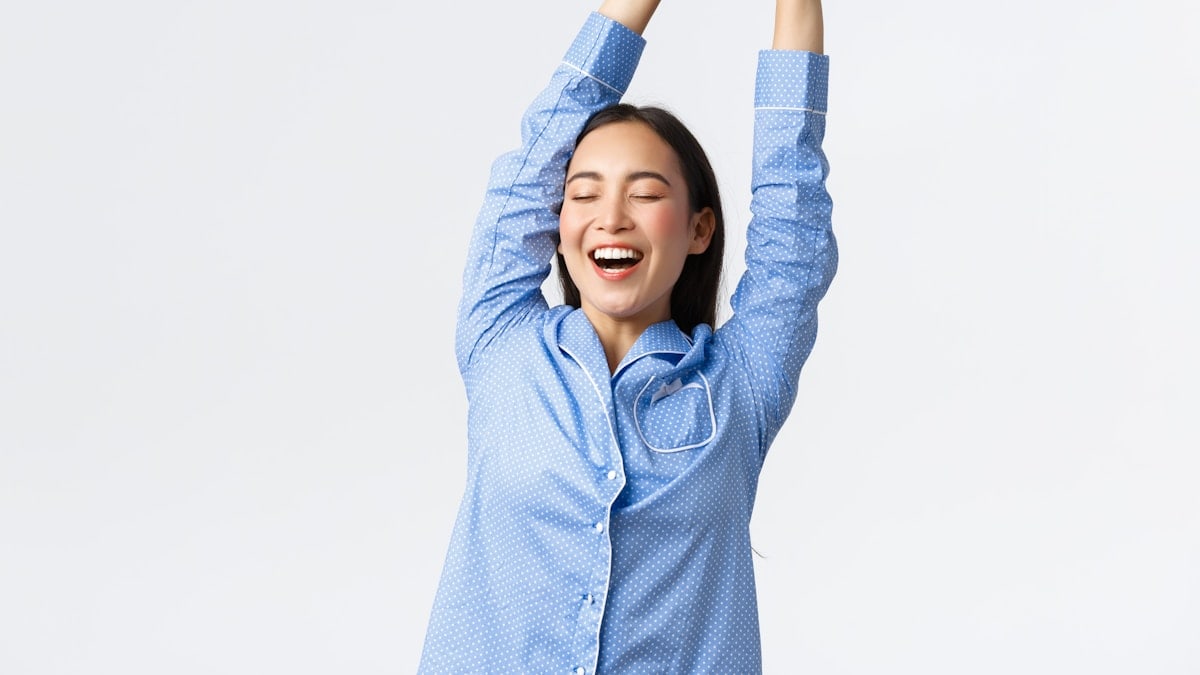 a woman with her arms in the air